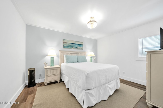 17462 Front Beach Rd Unit 11C1, Panama City Beach, FL 32413 - bedroom with baseboards and wood finished floors