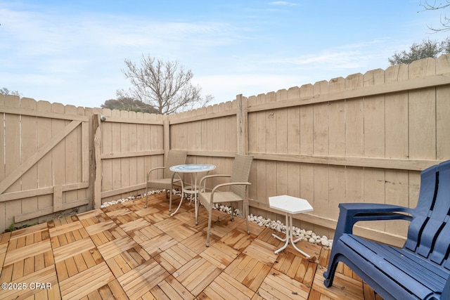 17462 Front Beach Rd Unit 11C1, Panama City Beach, FL 32413 - wooden terrace with a fenced backyard