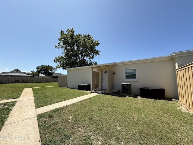 17462 Front Beach Rd Unit 11C1, Panama City Beach, FL 32413 - rear view of property featuring stucco siding and central AC unit
