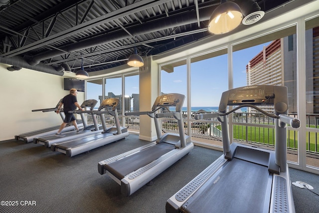 9902 S Thomas Dr Unit 237, Panama City Beach, FL 32408 - exercise room featuring baseboards