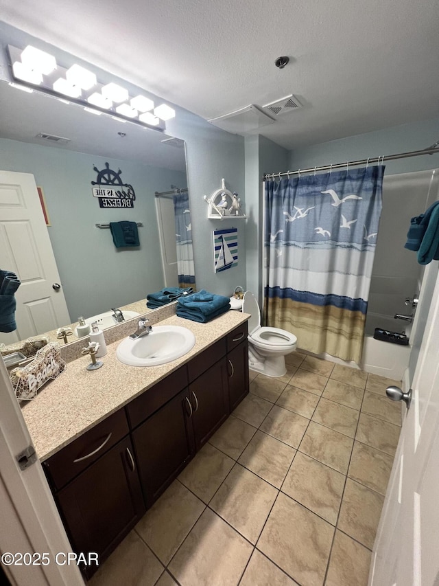 9902 S Thomas Dr Unit 237, Panama City Beach, FL 32408 - full bath featuring tile patterned floors, vanity, toilet, shower / bath combo, and a textured ceiling