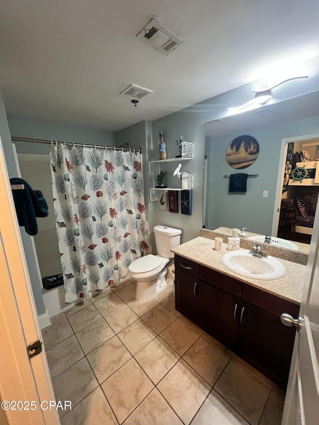 9902 S Thomas Dr Unit 237, Panama City Beach, FL 32408 - full bathroom featuring vanity, tile patterned flooring, toilet, and a shower with shower curtain