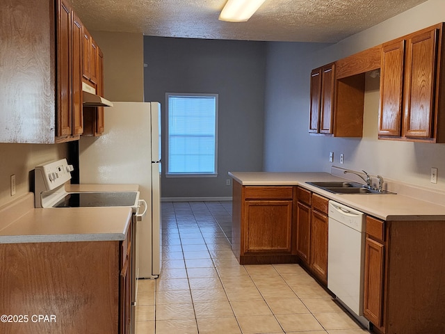5432-5434 Sunset, Panama City, FL 32408 - kitchen featuring dishwasher, a sink, under cabinet range hood, a textured ceiling, and light tile patterned floors