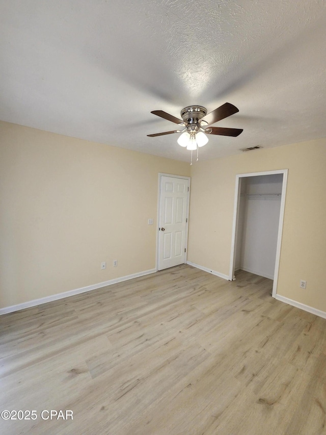 5432-5434 Sunset, Panama City, FL 32408 - unfurnished bedroom with light wood-type flooring, baseboards, ceiling fan, and a closet