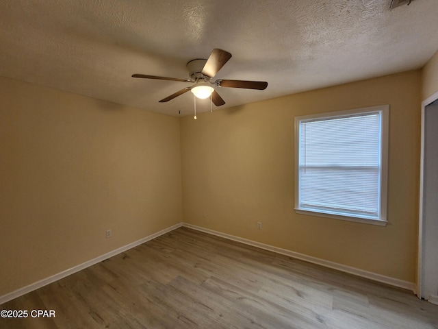 5432-5434 Sunset, Panama City, FL 32408 - empty room featuring wood finished floors, a ceiling fan, baseboards, and a textured ceiling