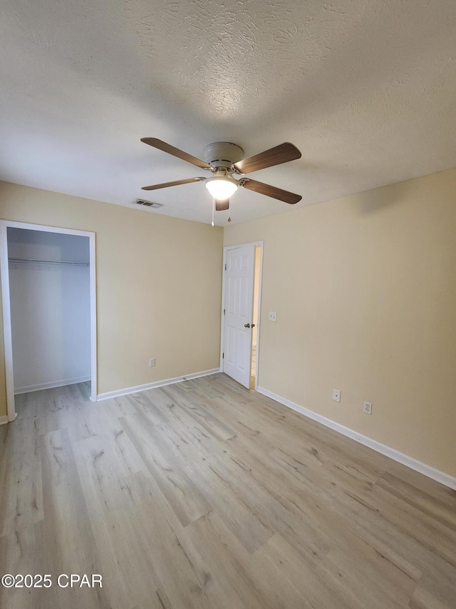 5432-5434 Sunset, Panama City, FL 32408 - unfurnished bedroom with light wood-style floors, baseboards, a textured ceiling, and ceiling fan