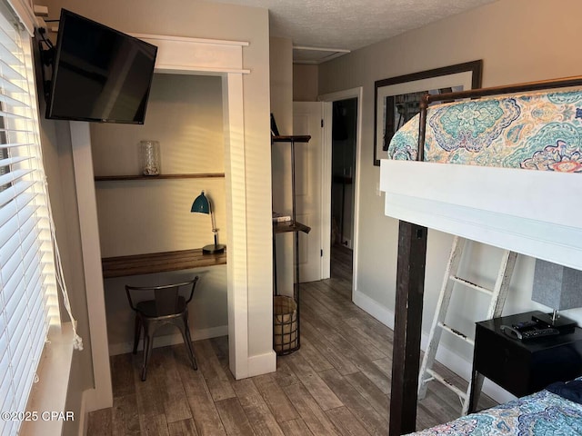 17214 Front Beach Rd Unit G-4, Panama City Beach, FL 32413 - bedroom featuring wood finished floors, baseboards, and a textured ceiling