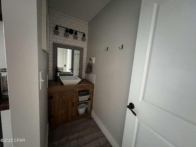 17214 Front Beach Rd Unit G-4, Panama City Beach, FL 32413 - bathroom with vanity, baseboards, and wood finished floors