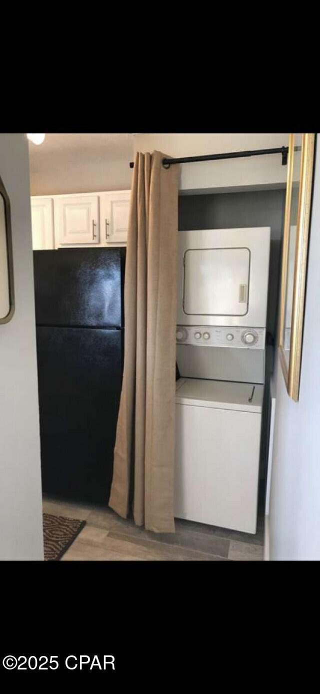 17214 Front Beach Rd Unit G-4, Panama City Beach, FL 32413 - laundry room featuring stacked washer and clothes dryer