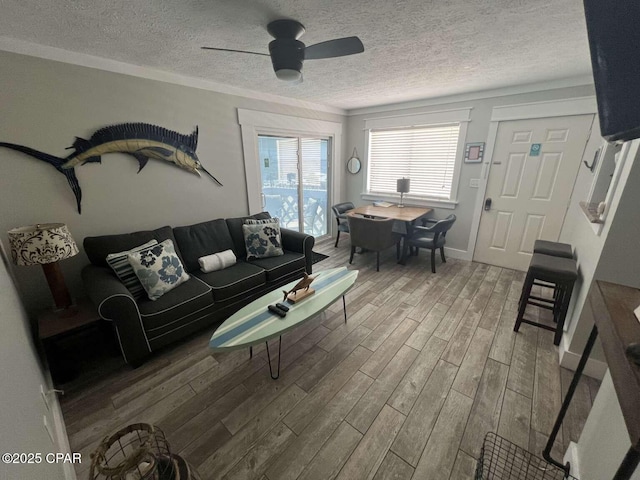 17214 Front Beach Rd Unit G-4, Panama City Beach, FL 32413 - living area featuring wood finished floors, a textured ceiling, and a ceiling fan