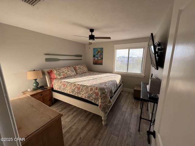 17214 Front Beach Rd Unit G-4, Panama City Beach, FL 32413 - bedroom with dark wood-style flooring, a textured ceiling, baseboards, and ceiling fan