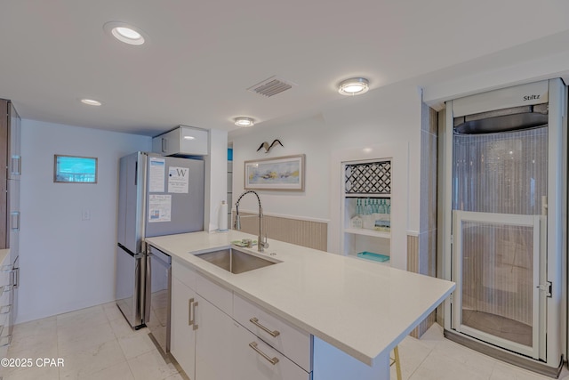 17735 Front Beach Rd Unit 2, Panama City Beach, FL 32413 - kitchen with a sink, stainless steel dishwasher, light countertops, white cabinets, and recessed lighting