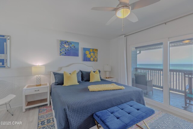 17735 Front Beach Rd Unit 2, Panama City Beach, FL 32413 - bedroom featuring access to exterior, a water view, a ceiling fan, and wood finished floors
