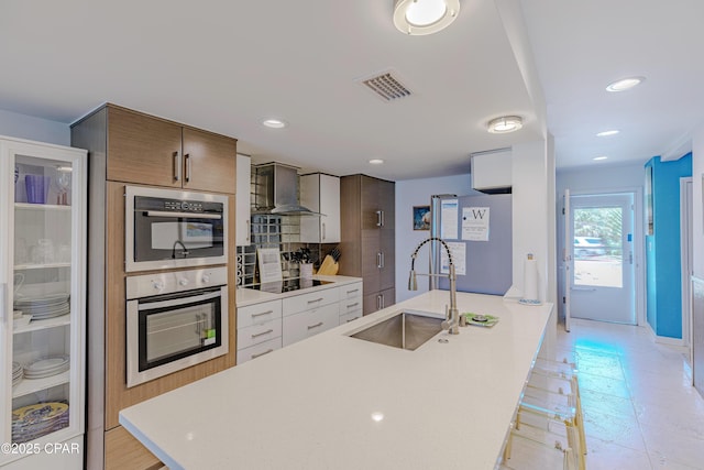 17735 Front Beach Rd Unit 2, Panama City Beach, FL 32413 - kitchen featuring wall chimney exhaust hood, a sink, light countertops, backsplash, and black electric cooktop