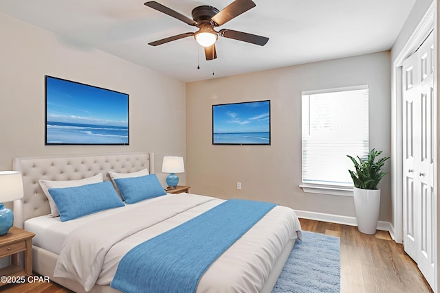 3729 E 9th St, Panama City, FL 32401 - bedroom with wood finished floors, baseboards, ceiling fan, and a closet