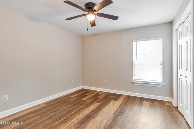 3729 E 9th St, Panama City, FL 32401 - unfurnished room featuring wood finished floors, baseboards, and ceiling fan