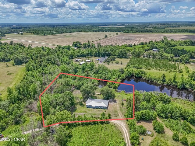 25966 George Maloy Ln, Altha, FL 32421 - aerial view of sparsely populated area featuring property boundaries highlighted, large plots for crops, and a nearby body of water