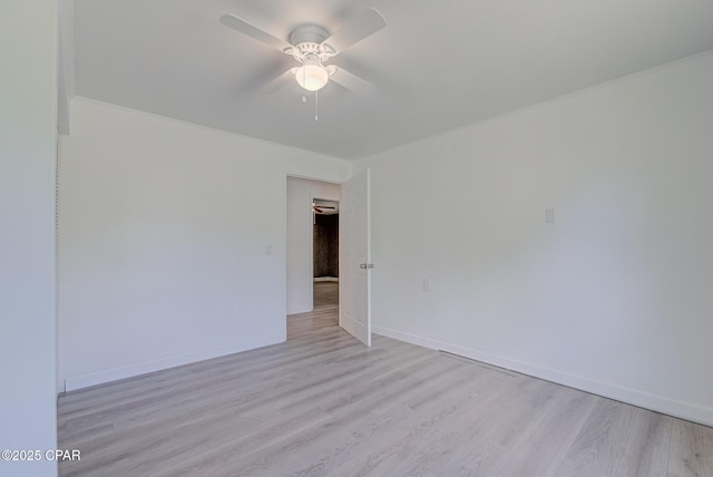25966 George Maloy Ln, Altha, FL 32421 - empty room with ceiling fan, light wood-type flooring, and baseboards