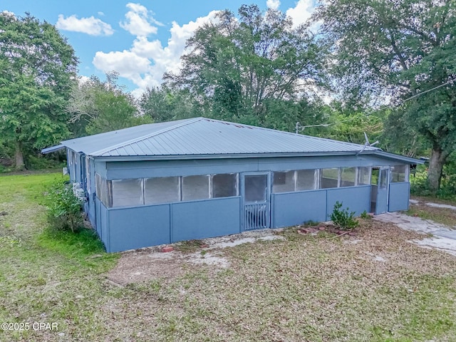 25966 George Maloy Ln, Altha, FL 32421 - garage with view of scattered trees