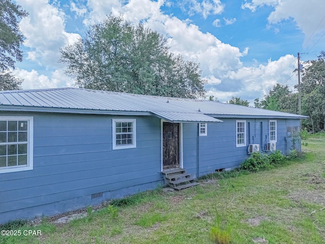 25966 George Maloy Ln, Altha, FL 32421 - rear view of property featuring crawl space, entry steps, and metal roof