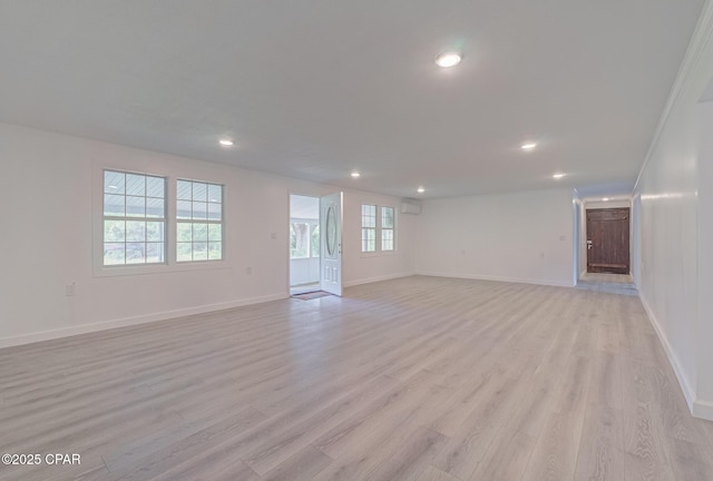 25966 George Maloy Ln, Altha, FL 32421 - unfurnished living room featuring recessed lighting, light wood-style flooring, and baseboards