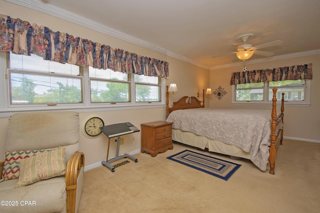 1206 Tyndall Dr, Panama City, FL 32401 - bedroom featuring multiple windows, carpet, baseboards, and crown molding