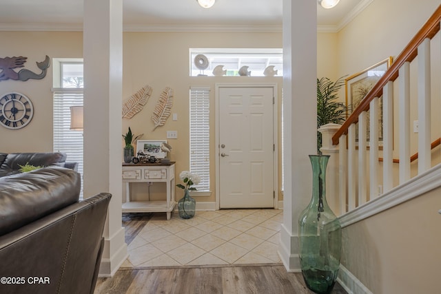 8700 Front Beach Rd Unit 8107, Panama City Beach, FL 32407 - entryway featuring ornamental molding, stairs, light wood finished floors, and baseboards