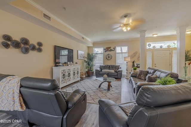 8700 Front Beach Rd Unit 8107, Panama City Beach, FL 32407 - living room featuring ornate columns, crown molding, and wood finished floors