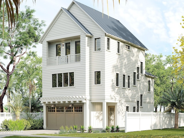 55 Grande Pointe Dr, Inlet Beach, FL 32461 - view of front of house with an attached garage, driveway, a balcony, and a metal roof