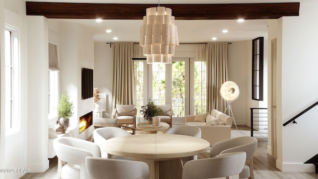 55 Grande Pointe Dr, Inlet Beach, FL 32461 - living room with beamed ceiling, a chandelier, light wood-type flooring, a lit fireplace, and recessed lighting