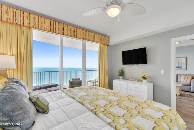 17545 Front Beach Rd Unit 2004, Panama City Beach, FL 32413 - bedroom featuring access to outside, wood finished floors, multiple windows, and a ceiling fan