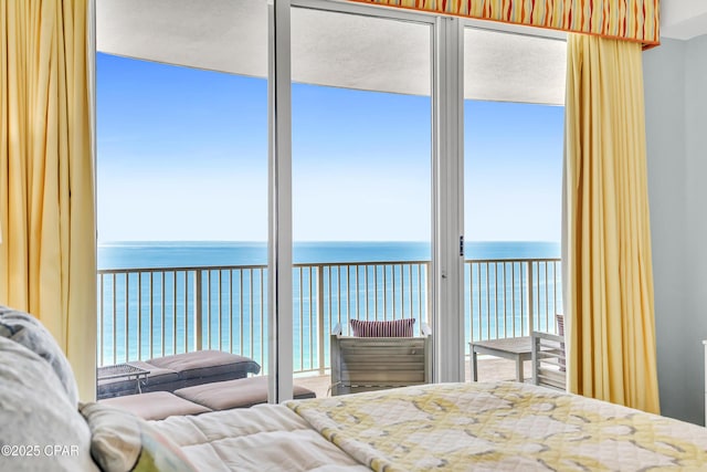 17545 Front Beach Rd Unit 2004, Panama City Beach, FL 32413 - bedroom with a water view, access to exterior, and multiple windows