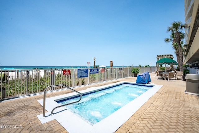 17545 Front Beach Rd Unit 2004, Panama City Beach, FL 32413 - view of swimming pool featuring a patio area and a water view