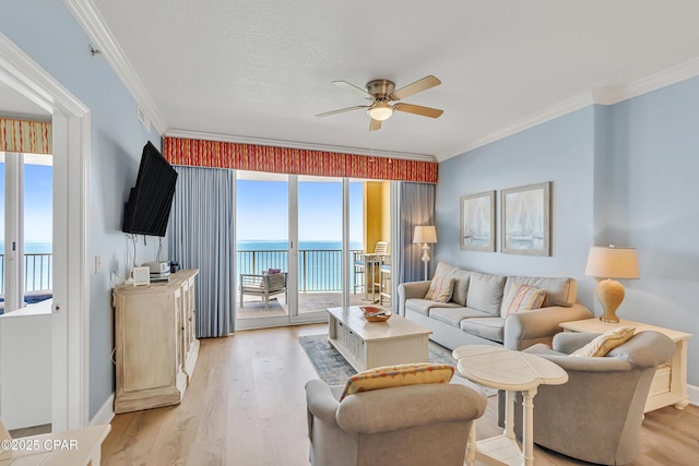 17545 Front Beach Rd Unit 2004, Panama City Beach, FL 32413 - living area with ceiling fan, light wood finished floors, ornamental molding, plenty of natural light, and baseboards
