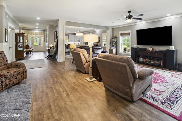 290 Rudys Blaze, Wewahitchka, FL 32465 - living room featuring crown molding, wood finished floors, decorative columns, a ceiling fan, and plenty of natural light