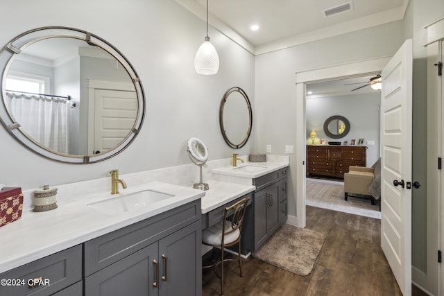 290 Rudys Blaze, Wewahitchka, FL 32465 - full bath with two vanities, ceiling fan, wood finished floors, recessed lighting, and crown molding
