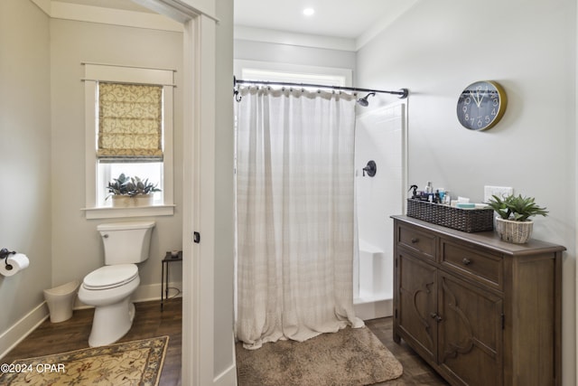 290 Rudys Blaze, Wewahitchka, FL 32465 - full bath with wood finished floors, toilet, shower / bath combo, and baseboards