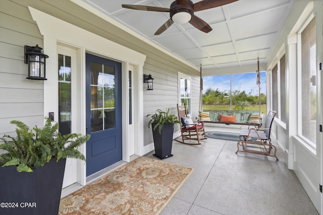 290 Rudys Blaze, Wewahitchka, FL 32465 - sunroom / solarium with wooden walls and speckle patterned floor