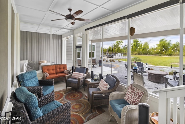 290 Rudys Blaze, Wewahitchka, FL 32465 - sunroom with a ceiling fan, an outdoor living space with a fire pit, and healthy amount of natural light