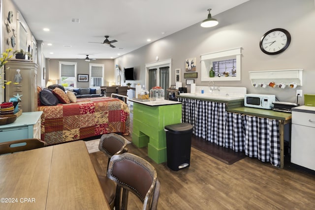 290 Rudys Blaze, Wewahitchka, FL 32465 - kitchen with white microwave, dark wood-type flooring, a ceiling fan, a center island, and open floor plan
