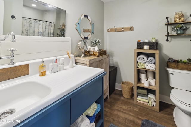 290 Rudys Blaze, Wewahitchka, FL 32465 - bathroom with toilet, wood finished floors, vanity, curtained shower, and baseboards