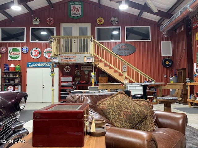 290 Rudys Blaze, Wewahitchka, FL 32465 - living area with wood walls, stairway, and electric water heater