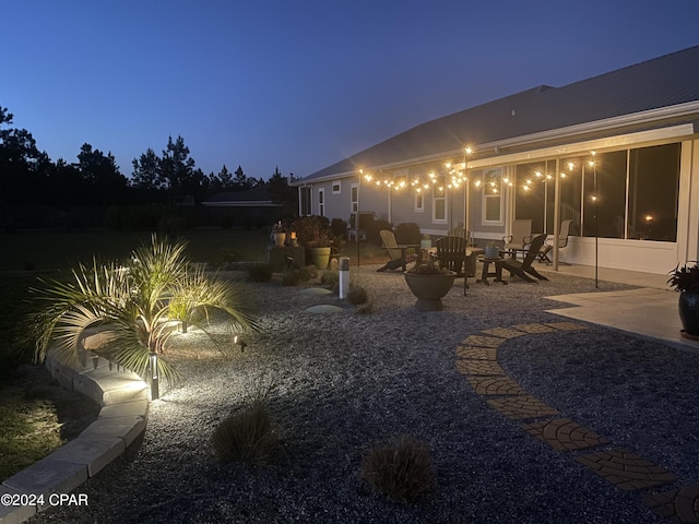 290 Rudys Blaze, Wewahitchka, FL 32465 - yard at night featuring a patio area