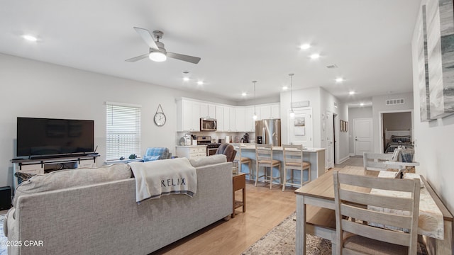113 Mosaic Dr, Port St Joe, FL 32456 - living area with a ceiling fan, light wood-style flooring, and recessed lighting
