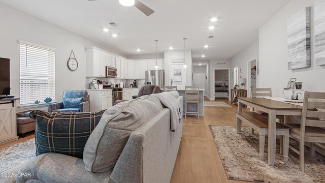 113 Mosaic Dr, Port St Joe, FL 32456 - living area featuring ceiling fan, light wood-style floors, and recessed lighting