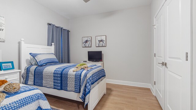 113 Mosaic Dr, Port St Joe, FL 32456 - bedroom featuring light wood-style flooring, a closet, baseboards, and ceiling fan