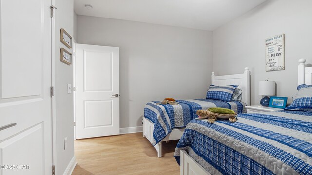 113 Mosaic Dr, Port St Joe, FL 32456 - bedroom featuring light wood-style flooring and baseboards