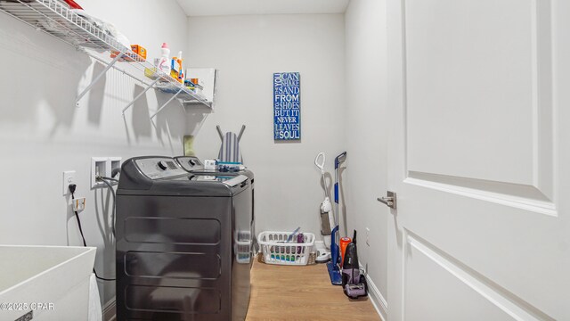 113 Mosaic Dr, Port St Joe, FL 32456 - washroom featuring washing machine and dryer and wood finished floors