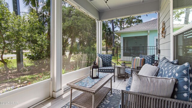 113 Mosaic Dr, Port St Joe, FL 32456 - sunroom with a ceiling fan and an outdoor living space