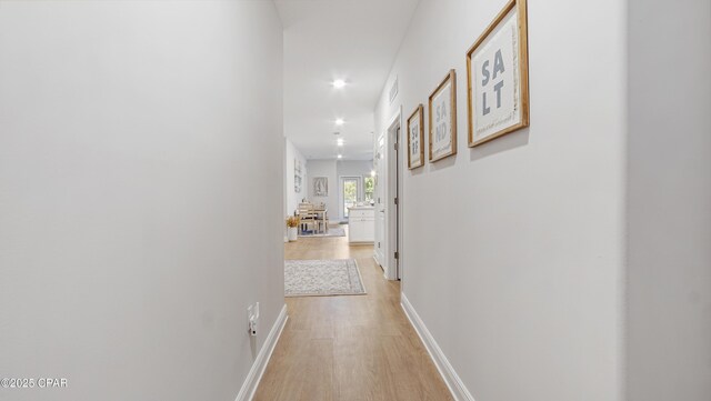 113 Mosaic Dr, Port St Joe, FL 32456 - hall featuring light wood-type flooring, baseboards, and recessed lighting